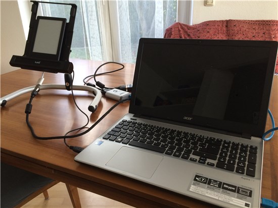 Picture of a laptop fitted with a mobile device stand